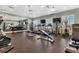 Spacious gym equipped with modern fitness machines, weights, and mirrored walls for effective workouts at 25272 E Lenox Cir, Punta Gorda, FL 33950