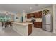 Open kitchen with stainless steel appliances, eat in dining and kitchen island at 25272 E Lenox Cir, Punta Gorda, FL 33950