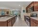 Well lit kitchen with modern stainless steel appliances and quartz countertops at 25272 E Lenox Cir, Punta Gorda, FL 33950