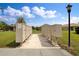 Community mailbox area with mature trees and serene landscaping at 25272 E Lenox Cir, Punta Gorda, FL 33950