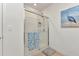 Bright white shower with glass door and tile surround at 25272 E Lenox Cir, Punta Gorda, FL 33950