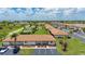 A stunning aerial view of a condo community showcasing well-manicured lawns and a sparkling pool at 25275 Rampart Blvd # 404, Punta Gorda, FL 33983