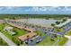 Scenic aerial of condo community overlooking a lake, mature trees and lush landscaping at 25275 Rampart Blvd # 404, Punta Gorda, FL 33983