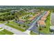 Aerial view features community pool, bocce ball court, convenient parking, and a serene landscape at 25275 Rampart Blvd # 404, Punta Gorda, FL 33983