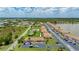 Great aerial shot of community featuring lush landscaping, walking paths, and a community pool at 25275 Rampart Blvd # 404, Punta Gorda, FL 33983