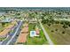 Aerial view showcases community pool, lawn area, bocce ball court, and convenient parking at 25275 Rampart Blvd # 404, Punta Gorda, FL 33983