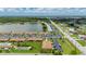 Nice aerial view of community with a lake, walking paths, and nicely maintained landscaping at 25275 Rampart Blvd # 404, Punta Gorda, FL 33983