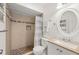 Bathroom featuring a tile shower, toilet, and a vanity sink with a mirror at 25275 Rampart Blvd # 404, Punta Gorda, FL 33983