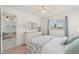 A view of a bedroom showing the furnishings and access to the living room at 25275 Rampart Blvd # 404, Punta Gorda, FL 33983