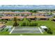 Aerial view showcases the community bocce ball court and lawn area in a waterfront community at 25275 Rampart Blvd # 404, Punta Gorda, FL 33983