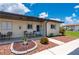 Charming condo exterior featuring a cozy porch area and well-maintained landscaping at 25275 Rampart Blvd # 404, Punta Gorda, FL 33983