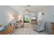 Cozy living room featuring comfortable seating, natural light, and a serene atmosphere at 25275 Rampart Blvd # 404, Punta Gorda, FL 33983