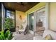 Relaxing sunroom features tiled flooring and comfortable seating for enjoying the views at 25275 Rampart Blvd # 404, Punta Gorda, FL 33983