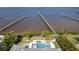 Aerial view of a beautiful property with a pool, docks, and waterfront access at 25462 Shore Dr, Punta Gorda, FL 33950