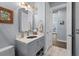 Nicely designed bathroom with single vanity, pendant lights, and neutral paint at 25462 Shore Dr, Punta Gorda, FL 33950