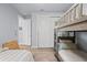 Cozy bedroom with bunk beds, closet, and modern neutral decor at 25462 Shore Dr, Punta Gorda, FL 33950