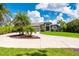 Beautiful home with a circular driveway and lush landscaping at 25462 Shore Dr, Punta Gorda, FL 33950