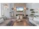 Cozy living room with a modern fireplace, stone accent wall, and stylish decor at 25462 Shore Dr, Punta Gorda, FL 33950