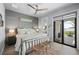 Beautiful bedroom with coastal decor and access to a private outdoor patio at 25462 Shore Dr, Punta Gorda, FL 33950