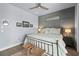 Comfortable bedroom features paneling, coastal decor, and soft, cozy textures at 25462 Shore Dr, Punta Gorda, FL 33950