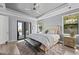 Main bedroom features wood floors, comfortable seating, and natural light at 25462 Shore Dr, Punta Gorda, FL 33950