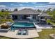 Stunning home showcasing a pristine pool, hot tub, lounge area, and seamless indoor-outdoor living at 25462 Shore Dr, Punta Gorda, FL 33950