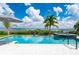 Beautiful pool area overlooking the water with a hot tub, lounge chairs, and ample space for entertaining at 25462 Shore Dr, Punta Gorda, FL 33950