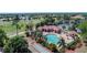 This aerial view highlights the pool, clubhouse, golf course, and tennis courts, showcasing the community's recreational amenities at 26254 Stillwater Cir, Punta Gorda, FL 33955