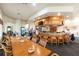 Inviting bar area with ample seating, a full bar, and comfortable socializing space at 26254 Stillwater Cir, Punta Gorda, FL 33955