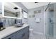 Contemporary bathroom featuring sleek vanity, glass shower, and modern fixtures at 26254 Stillwater Cir, Punta Gorda, FL 33955