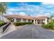Elegant building exterior with a red tile roof, manicured landscaping, and welcoming entrance at 26254 Stillwater Cir, Punta Gorda, FL 33955