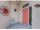 Inviting front porch with colorful decor, a decorative sun, and a cozy welcome at 26254 Stillwater Cir, Punta Gorda, FL 33955