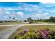 Scenic view of a well-maintained golf course, beautiful landscaping, and clear blue skies at 26254 Stillwater Cir, Punta Gorda, FL 33955