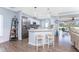 Modern kitchen with a breakfast bar, stainless steel appliances, and backyard views at 26254 Stillwater Cir, Punta Gorda, FL 33955