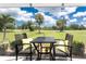 Serene lanai offering picturesque golf course views and comfortable seating at 26254 Stillwater Cir, Punta Gorda, FL 33955