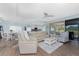 Open living space with comfortable seating and access to outdoor views at 26254 Stillwater Cir, Punta Gorda, FL 33955