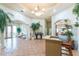 Spacious lobby area with tiled floor, plants, natural light, and access to other amenities at 26254 Stillwater Cir, Punta Gorda, FL 33955
