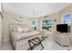 Serene main bedroom featuring a comfortable bed, natural light, and coastal decor at 26254 Stillwater Cir, Punta Gorda, FL 33955