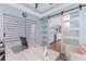 Bright office featuring a modern desk and barn door opening up to the kitchen at 26254 Stillwater Cir, Punta Gorda, FL 33955