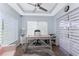 Bright office space with a large window, modern desk, and neutral tones at 26254 Stillwater Cir, Punta Gorda, FL 33955