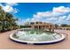 A community pool with a depth of 3 ft 8 in is surrounded by lounge chairs and lush palm trees, offering a resort-like feel at 26254 Stillwater Cir, Punta Gorda, FL 33955