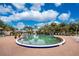 A community pool is surrounded by lounge chairs and greenery, offering a relaxed and inviting space for residents at 26254 Stillwater Cir, Punta Gorda, FL 33955