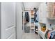 Organized walk-in closet with custom shelving, drawers and hanging racks at 26254 Stillwater Cir, Punta Gorda, FL 33955