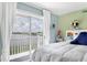 Bedroom showcasing a beautiful lake view and sliding glass doors at 26310 Rampart Blvd # 504, Punta Gorda, FL 33983