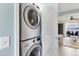 A stacked washer and dryer unit is conveniently located near the living area at 26310 Rampart Blvd # 504, Punta Gorda, FL 33983