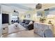 Cozy living room boasts comfortable seating, a ceiling fan, and views of the water at 26310 Rampart Blvd # 504, Punta Gorda, FL 33983