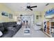 Comfortable living room with seating, TV, and natural light at 26310 Rampart Blvd # 504, Punta Gorda, FL 33983