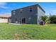 A spacious backyard featuring a patio area ideal for outdoor entertaining and relaxation at 2736 Suncoast Lakes Blvd, Punta Gorda, FL 33980