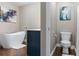 Modern bathroom features a soaking tub, stylish fixtures, and toilet, offering a spa-like retreat at 2736 Suncoast Lakes Blvd, Punta Gorda, FL 33980