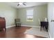 This empty bedroom has hardwood floors and a window for natural light at 2736 Suncoast Lakes Blvd, Punta Gorda, FL 33980